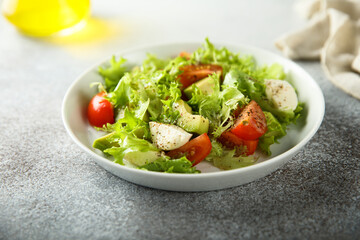 Healthy avocado salad with mozzarella cheese
