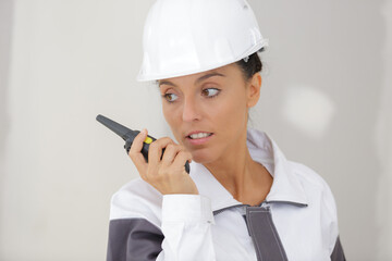 young woman holding radio communications