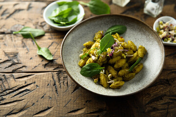 Homemade pasta with spinach pesto