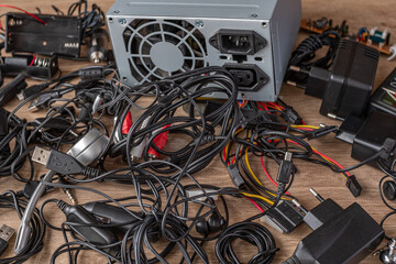 Bunch of old wires, connections, headphones and chargers for electronic devices Old wires,...