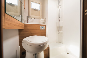 Naklejka na ściany i meble The toilet of a mobile home. Inside the interior of a motorhome
