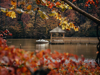 Boast at the dock on a lake in the foliage