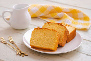 Butter cake sliced on white plate