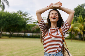 smiling woman walk fun freedom park summer t-shirt beautiful nature lifestyle