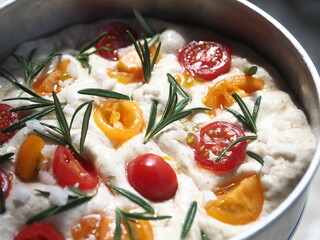 focaccia bread with tomato and rosemary topping