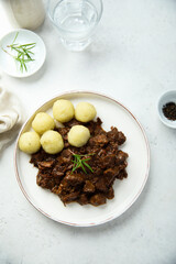 Homemade beef ragout with potato dumplings