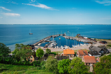 View over Kyrkbacken harbor on the Swedish island Ven in the Oresund strait. Denmark can be seen in...