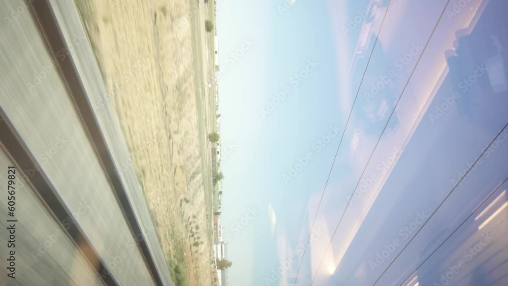Poster train tracks from a passenger window, tracks speeding by vertically