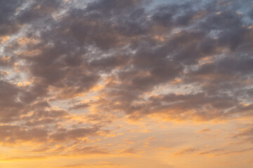 Naklejka na ściany i meble Beautiful sunset sky with grey clouds