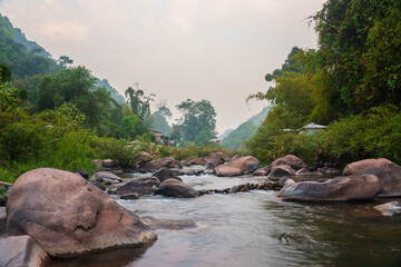 Thailand beautiful and calm rural view of the river in the mountains.