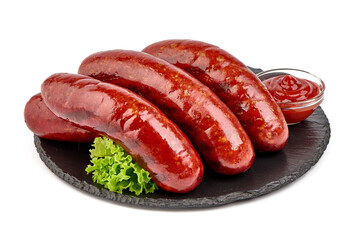 German grilled pork sausages, close-up, isolated on white background.