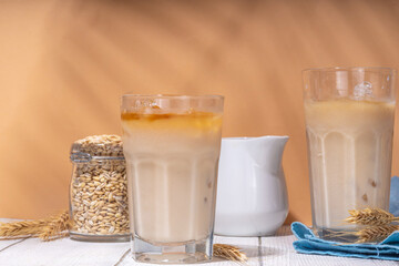 Iced barley orzo latte coffee, iced organic alternative coffee drink with crushed ice and non-dairy milk