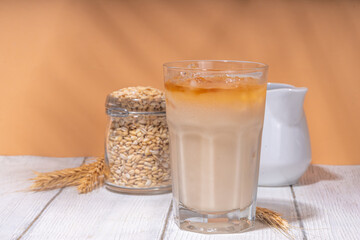 Iced barley orzo latte coffee, iced organic alternative coffee drink with crushed ice and non-dairy milk