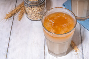 Iced barley orzo latte coffee, iced organic alternative coffee drink with crushed ice and non-dairy milk