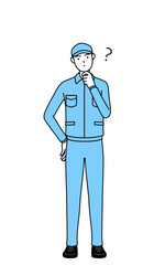 疑問を持って首をかしげる帽子と作業着姿の男性