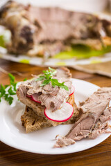 sandwich with baked meat, radish and herbs