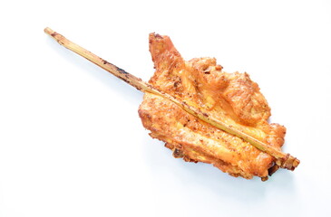 roasted chicken tight stabbing wooden stick on white background 