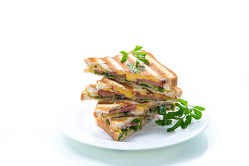 fried toasts stuffed with sausage, cheese and greens inside, on white background.