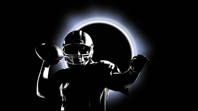 Animation of silhouette of male rugby player throwing a ball over glowing ring on black background