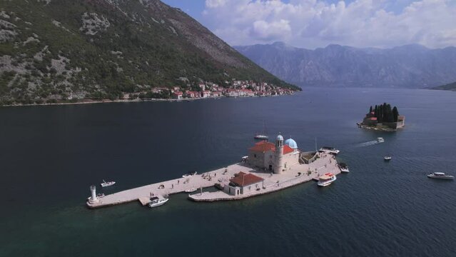 Aerial panoramic drone view of Our Lady of the Rocks and St. George's Islands, near Perast, Bay of Kotor, UNESCO World Heritage Site, Montenegro