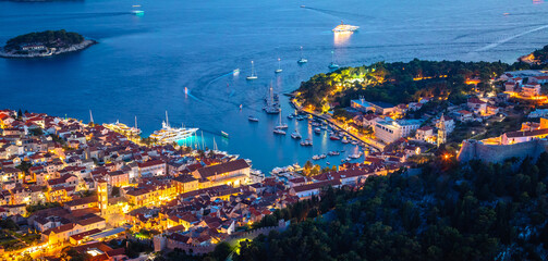 Aerial view of Hvar rooftops and harbor evening panoramic view