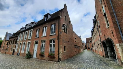 Deurstickers Historical streets with cobble-stones in Groot Begijnhof (Great Beguinage) in Leuven, Belgium. The beguinage dates from the 13th century.  © Marieke