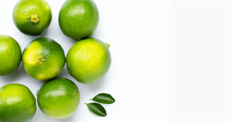 Fresh limes isolated on white background.