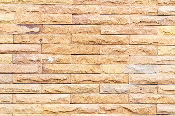 Background texture abstract pattern light yellow orange grunge brick wall stand out for stone tile block painted in wallpaper. Modern interior exterior room backdrop design can be use model building. 
