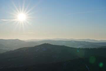 Sun on sky over Silesian Beskid near Bialy Krzyz, Szczyrk in Poland