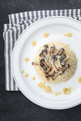 rice with mushrooms risotto healthy meal food snack on the table copy space food background rustic top view keto or paleo diet veggie vegan or vegetarian food no meat