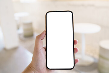 Women's hands holding cell telephone blank copy space screen. smartphone with blank white screen isolated. smart phone with technology concept.