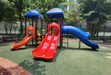 Children's playgrounds in the park, swings and slides for children to play.
