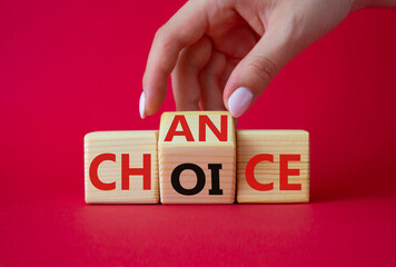 Chance and Choice symbol. Businessman hand turns wooden cubes with words Choice and Chance. Beautiful red background. Chance and Choice and business concept. Copy space