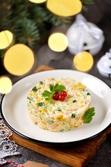Festive Russian salad with shrimps, canned corn, cucumber, egg, cheese and mayonnaise