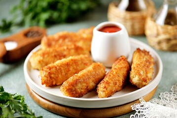 Fried meat sticks with tomato sauce