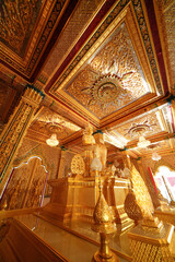 Obraz premium Inside the Golden Church of Wat Tha Sung, Uthai Thani Province, Thailand, everything in here, including the Buddha images, ceilings and doors, are all gold. Taken 7 May 2023.