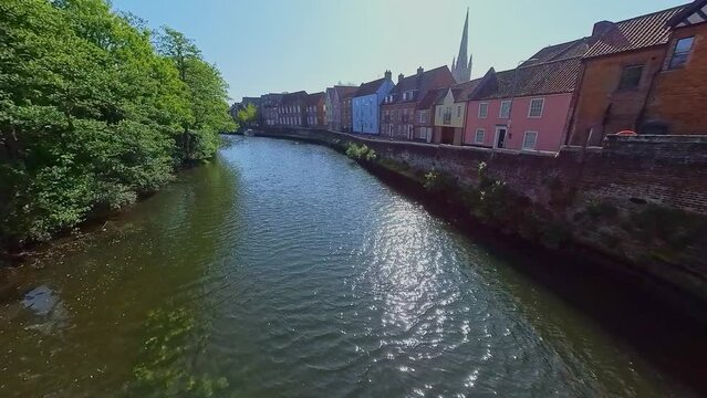 Shot across the River Wensum and the historic Quayside in the city of Norwich. Captured on a bright and sunny morning from the historic Fye Bridge