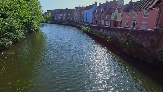 Shot across the River Wensum and the historic Quayside in the city of Norwich. Captured on a bright and sunny morning from the historic Fye Bridge