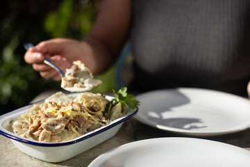 person holding a bowl of food