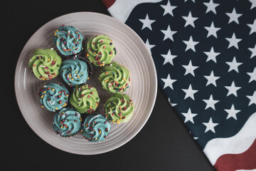 Independence Day 4th of July. Congratulations background. American Constitution Day. Postcard in the American tradition. Cupcakes decorated with symbols of America