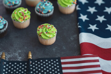 Independence Day 4th of July. Congratulations background. American Constitution Day. Postcard in the American tradition. Cupcakes decorated with symbols of America