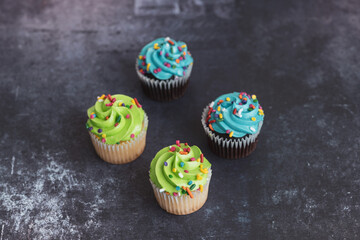 On a textured dark background, cakes.Celebration