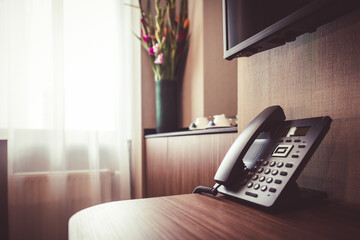 Phone at the desk in hotel room.