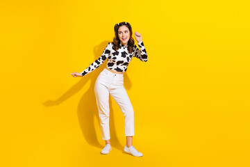 Full body photo of pretty lovely girl wear milk cow printed outfit dancing isolated on bright color background