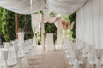 Beautiful wedding venue with white and beige details decoration