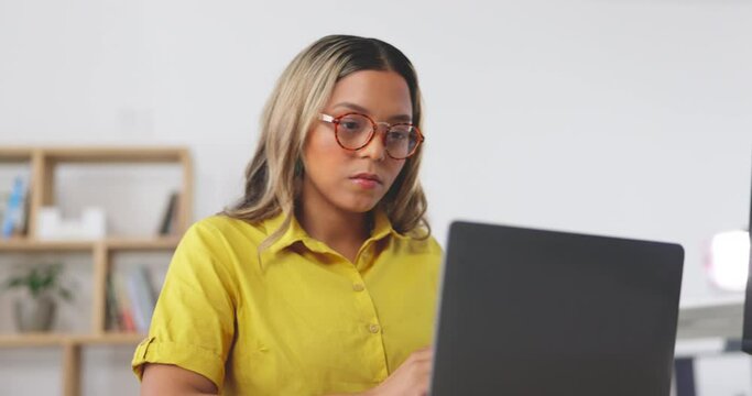 Woman, laptop and typing for email, research or business communication or proposal at the office. Focused female working on computer in creative startup, networking or administration at the workplace