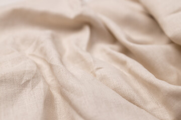 Natural linen fabric texture. Rough crumpled burlap background. Selective focus
