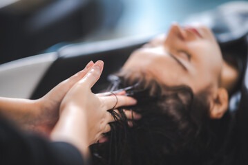 client woman clean washing a hair in salon, professional hairdresser washing haircut customer hair with water and shampoo treatment, coiffure beauty head hair care, fashion service