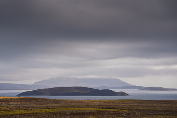Fototapeta premium Landscape in Iceland. Dramatic sky clouds over hills mountains and lakes of Iceland.