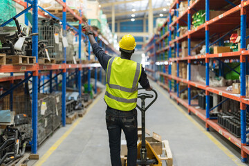 Male clerk pushing a cart or picking cart.